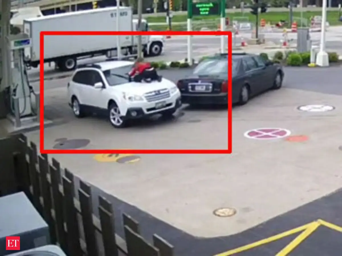Woman jumps on hood to stop car theft - The Economic Times Video | ET Tv