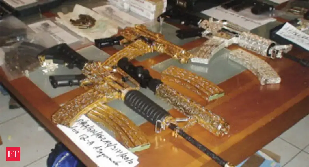 Gold plated rifle - | The Economic Times