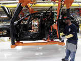 A worker attaches doors