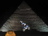 Freestyle biker in front of Giza pyramids 