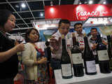 Customers from China taste red wine