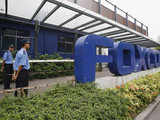 Security guards stand at the entrance to a Foxconn factory