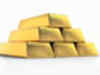 Gold firms after dip as debt woes linger