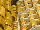 Gold declines further on sluggish global cues, silver tumbles