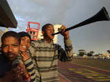 Children pose with a vuvuzela