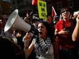 Demonstrators march though downtown