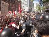 Demonstrators face police in riot gear