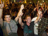 Protestors kneel in the street