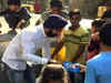 Delhi BJP leader distributes firecrackers to kids