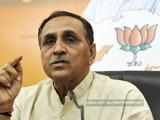 Congress seeks Rupani's scalp after Sebi order