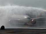 Water cannon salute to an AI aircraft, the first to land at T3