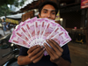 Rupee slips from 2-week high as crude spurts