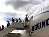 Guests exit a Boeing 787 Dreamliner aircraft