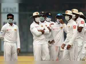 Sri lankan cricketers with masks, Del, In house photo