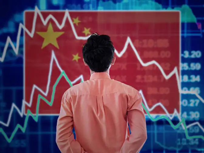 China stocks fall as PBOC researcher calls for higher rates