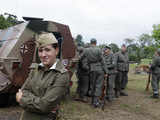 Enthusiasts re-enact a World War II battle scene