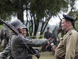 Enthusiasts re-enact a World War II battle scene