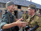 Enthusiasts re-enact a World War II battle scene