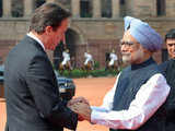 Manmoham Singh shakes hands with David Cameron