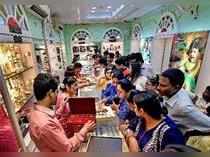 Kolkata: Women buying Gold jewellery at a Jewellery shop on the occasion of Dhan...