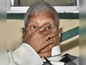 Patna: RJD chief Lalu Prasad addressing a press conference at his residence in P...