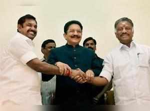 Chennai: Tamil Nadu Chief Minister K Palaniswami greeting O Panneerselvam after ...