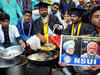 Students donning degree robes sell pakodas near Modi's rally venue