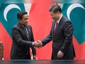 Beijing : Maldives' President Abdulla Yameen, left, shakes hands with China's Pr...
