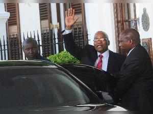 Cape Town : South African President Jacob Zuma, waves as he leaves parliament in...