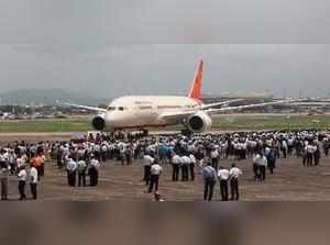 FILE PHOTO:::: New Delhi: Air India employees gather around a newly acquired Air...