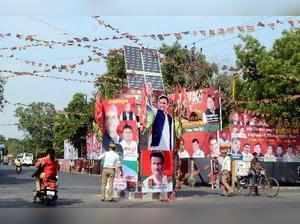 Agra: Posters and banners of Samajwadi Party leaders put up at a round-about in ...