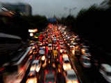 Vehicles move at a snail's pace after a downpour in New Delhi