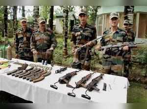 Uri: Army displaying arms and ammunition recovered from the infiltrators killed ...