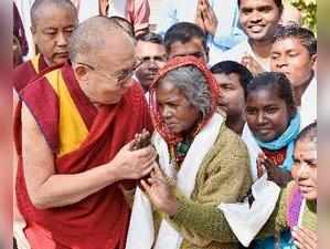 Bodh Gaya: Tibetan spiritual leader the Dalai Lama meets with local workers at a...