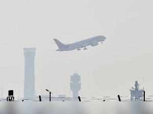 New Delhi: A plane takes off from IGI Airport in New Delhi on foggy Sunday morni...