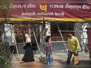 Mumbai: People walk past as CBI team seals Punjab National Bank's South Mumbai b...