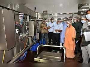 Lucknow: Uttar Pradesh Chief Minister Yogi Adityanath inspect Amul Milk Plant i...