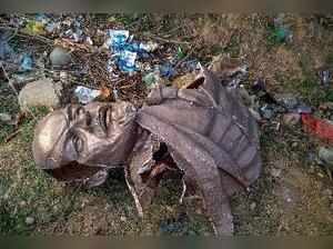 Belonia: Remains of the five-feet-tall statue of Lenin which was allegedly demol...