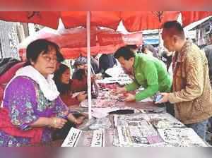 Darjeeling: People buying newspapers during GJM's stike in Darjeeling on Friday....