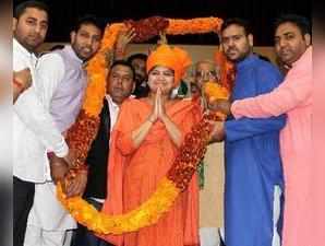 Jammu: BJYM National President and MP Poonam Mahajan being garlanded during a pa...