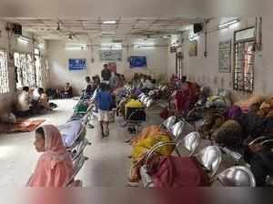 New Delhi: Patients with their relatives wait at the LNJP hospital after its Res...