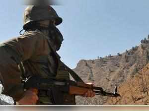 Poonch: An army jawan keeps vigil in Poonch district of Jammu and Kashmir on Sun...