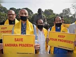 New Delhi: TDP MPs from Andhra Pradesh display placards at a protest demanding s...