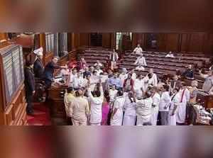New Delhi: Opposition members protest in the well of the Rajya Sabha in New Delh...