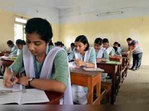 Dharmanagar: School students appear in TBSE's intermediate exams at an examinati...