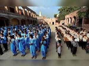 Sirsa: Students of a government school take part in the morning assembly prayers...