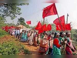 Birbhum: Left Front supporters taking part in a mass rally to protest against th...