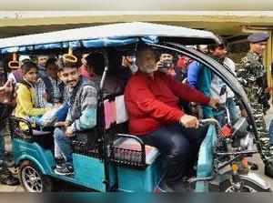Patna: an Adhikar party Chief and MP Pappu Yadav rides an e-rickshaw during a ca...