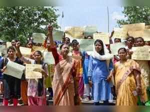 Ranchi: SC/ST community women hold placards and raise slogans to protest against...