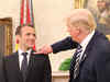 A special relationship: Donald Trump flicks 'dandruff' off Emanuel Macron's suit